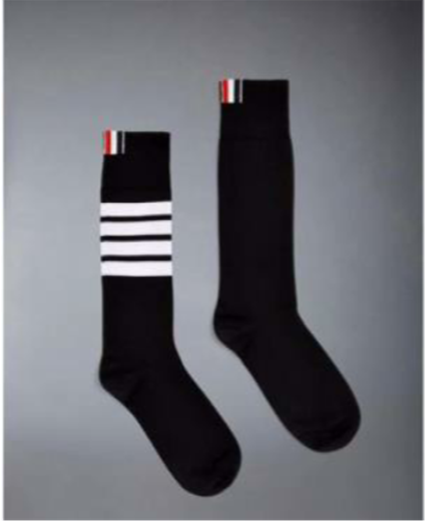 A pair of black socks with white stripes

Description automatically generated